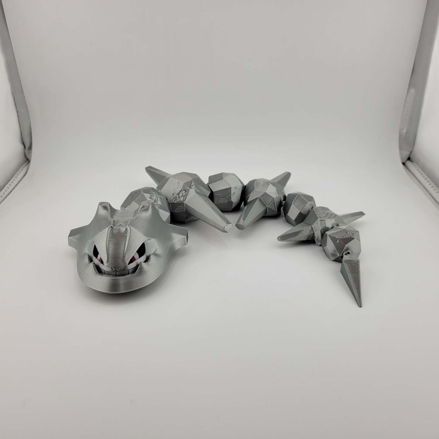 Articulated Steelix Pokémon 3D printed toy, durable steel-type design.