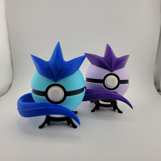 Articuno Pokeball toy with blue and purple variants, designed for Pokémon trainers.