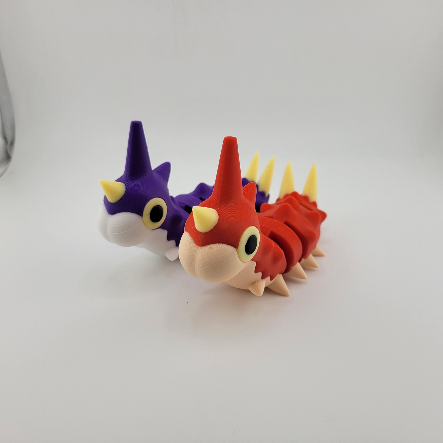 Wurmple (Articulated) Pokémon figurine in red and purple, collectible toy with articulated design.