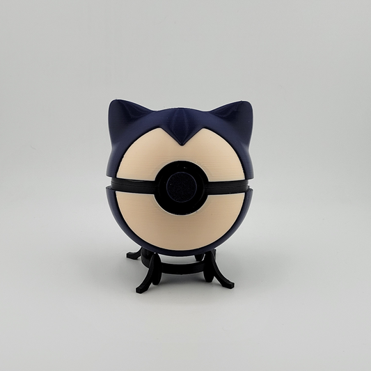 Snorlax Ball with blue and beige design on a display stand.
