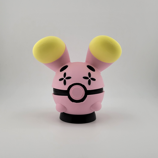 Whismur-themed Poké Ball pink and yellow 3D printed Poké Ball with oversized ears.