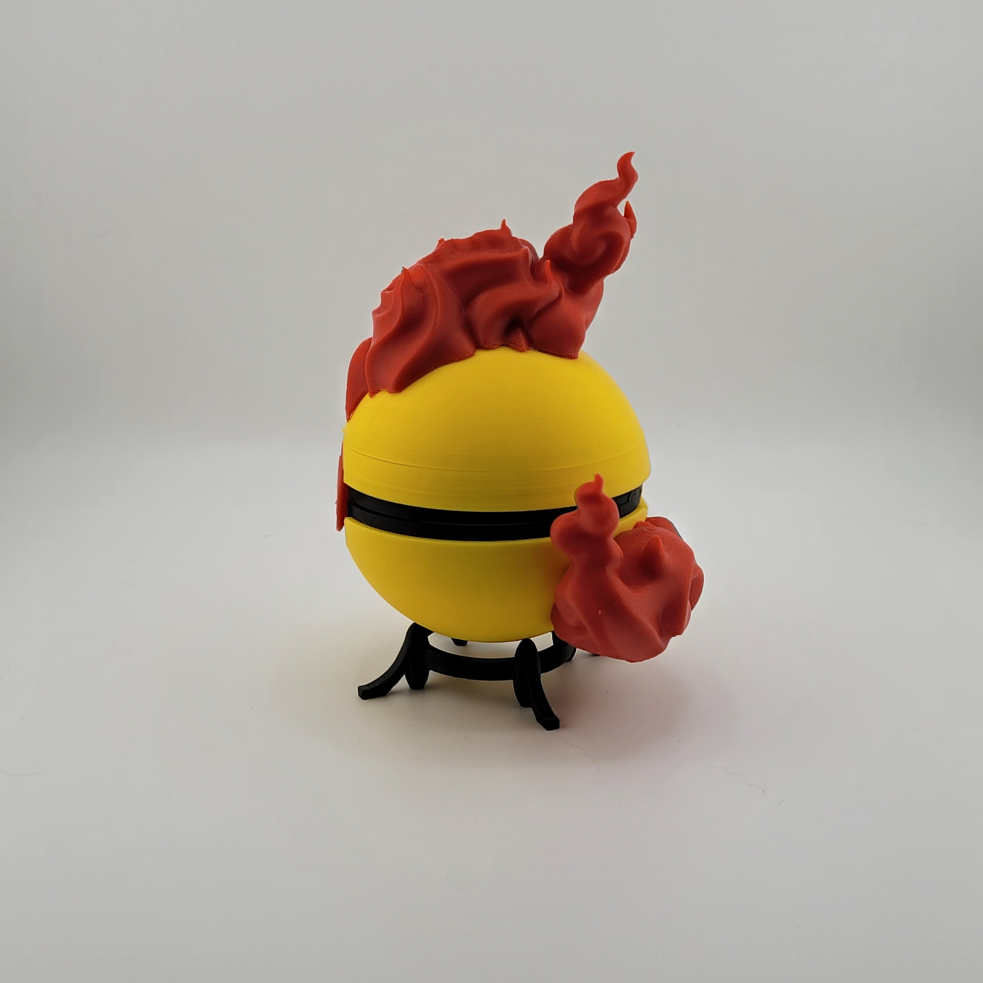 Legendary Moltres Pokeball 3D print with fiery design, made from durable PLA plastic.
