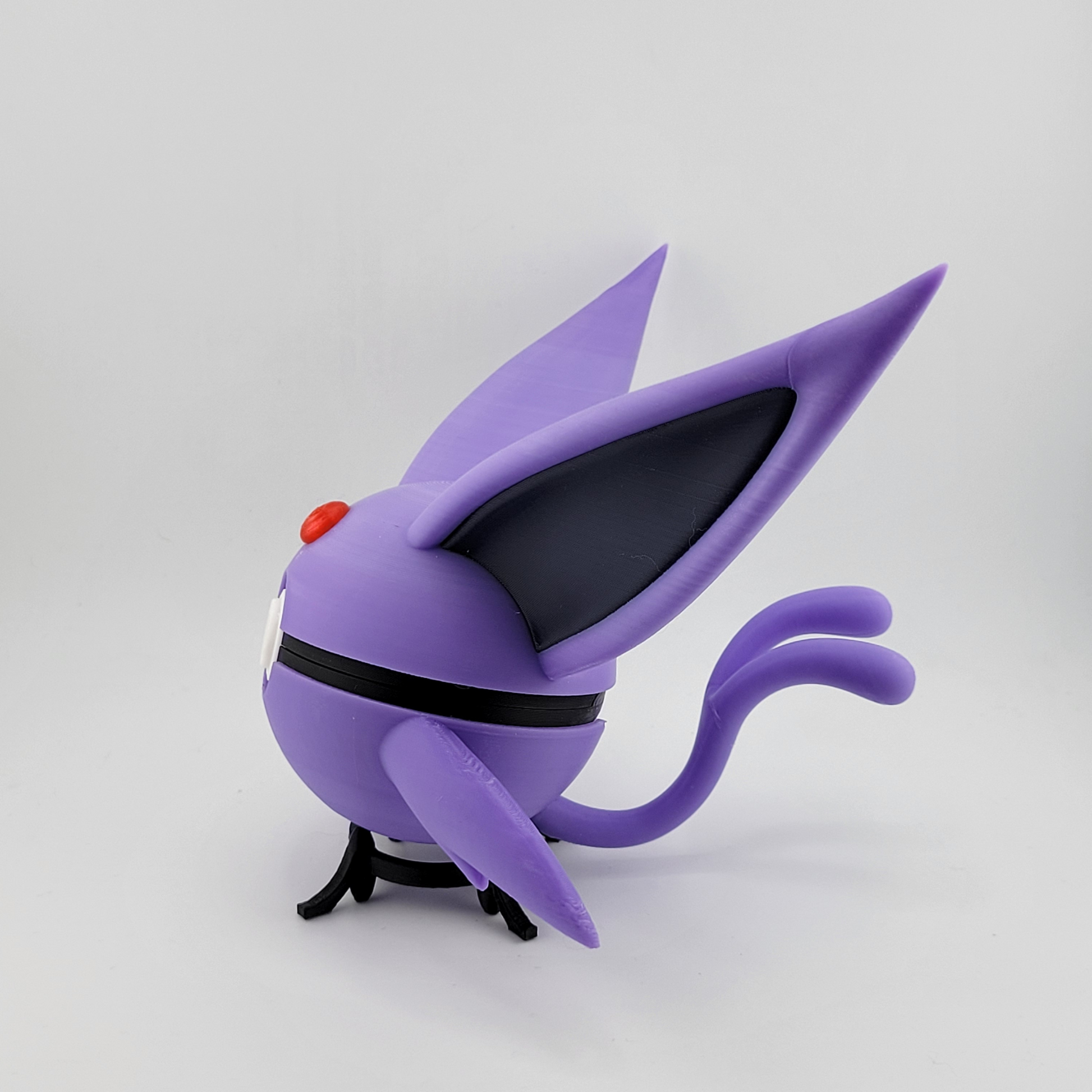Espeon Pokeball 3D printed sculpture with purple design and black accents.