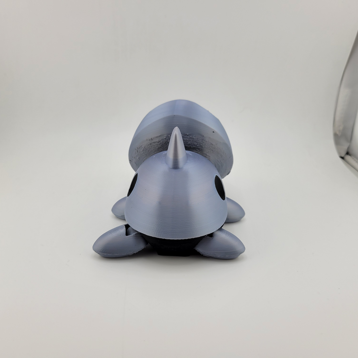 Detailed Articulated Aron Pokémon action figure with articulated limbs, featuring a metallic body and rock shell, ideal for collectors and fans.