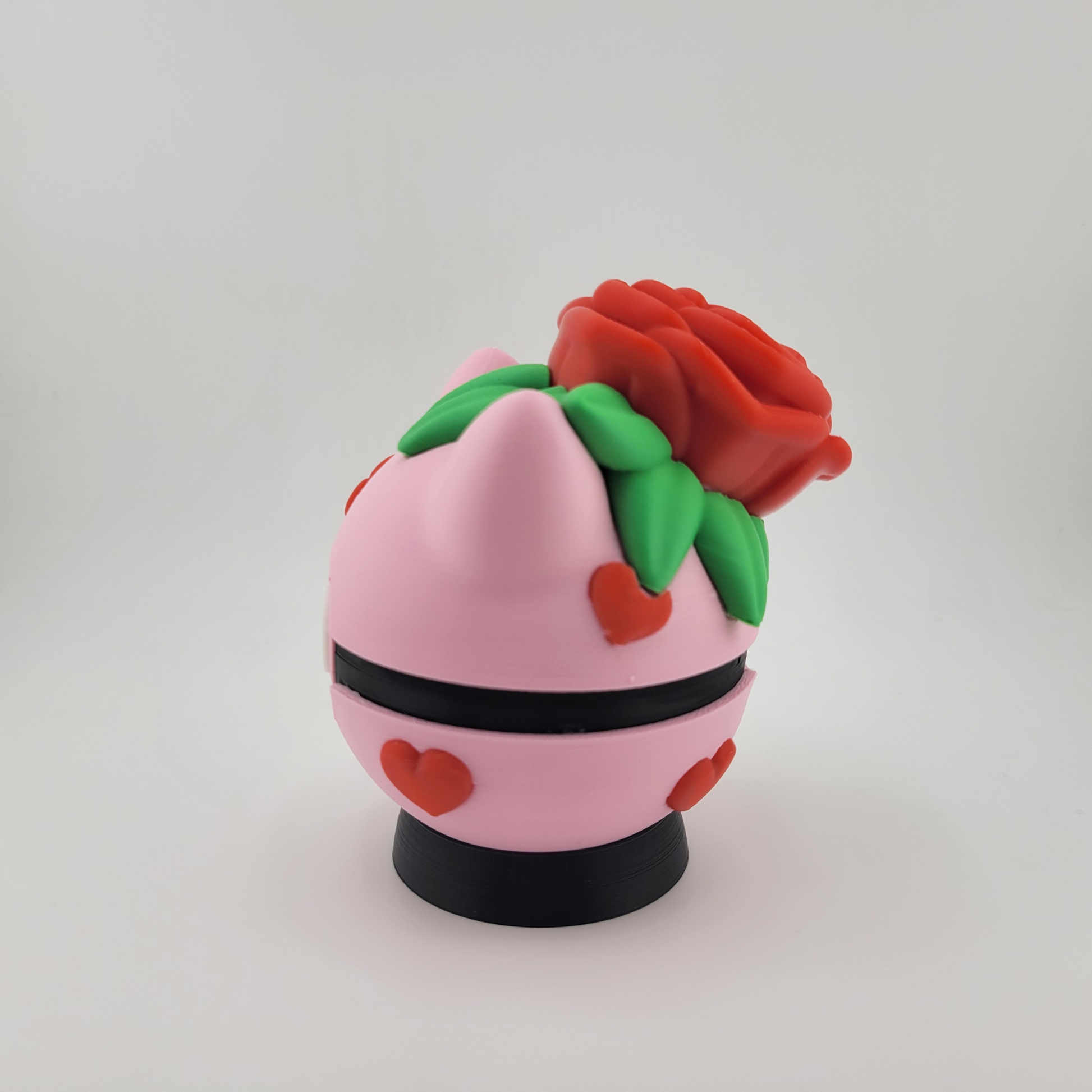 Rose Bulbasaur Pokeball with floral design, handcrafted 3D print in pink and green tones.