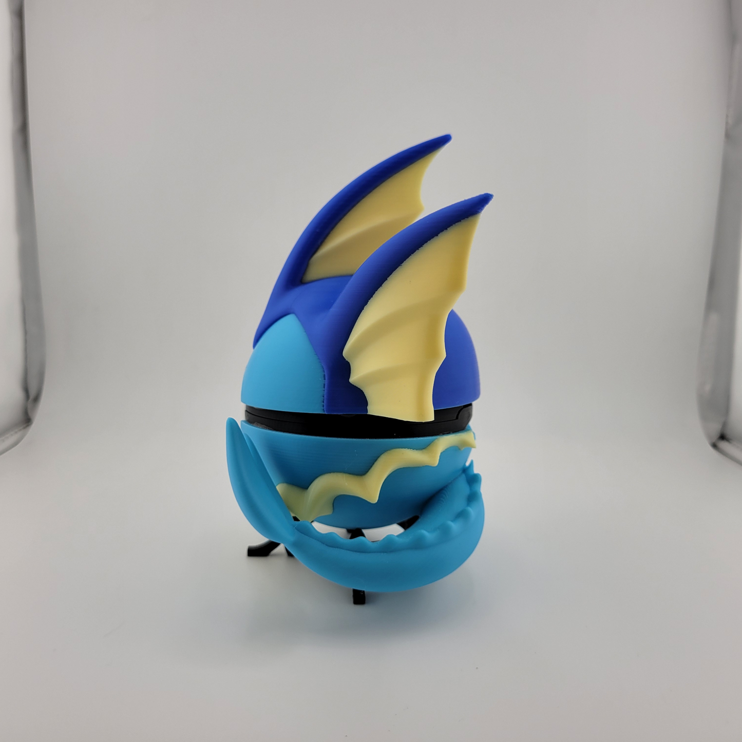 Vaporeon Pokeball 3D printed figure with blue and yellow detailing, inspired by Pokémon.