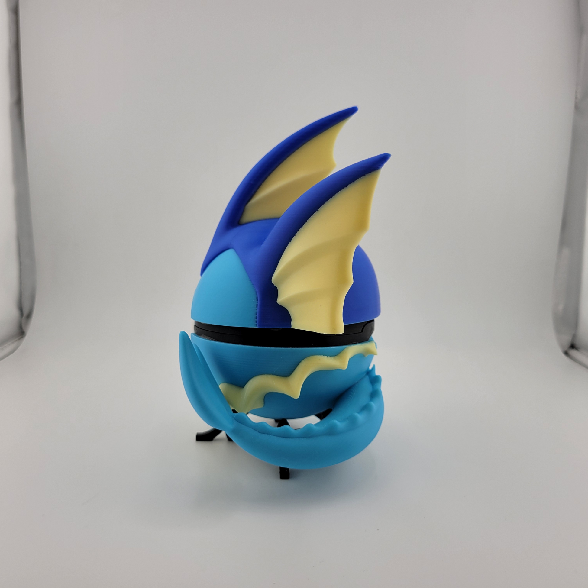Vaporeon Pokeball 3D printed figure with blue and yellow detailing, inspired by Pokémon.