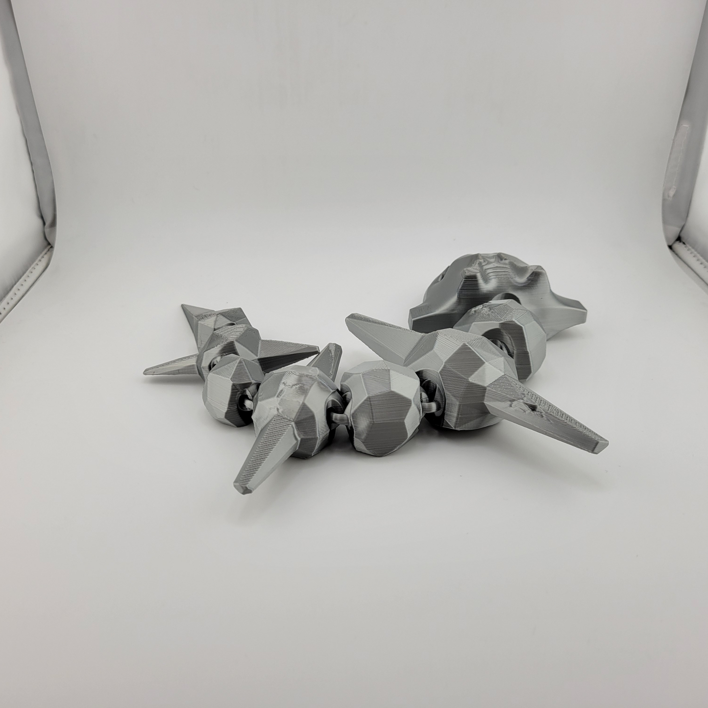 Articulated Steelix toy, 3D printed steel-type Pokémon with strong, durable construction.