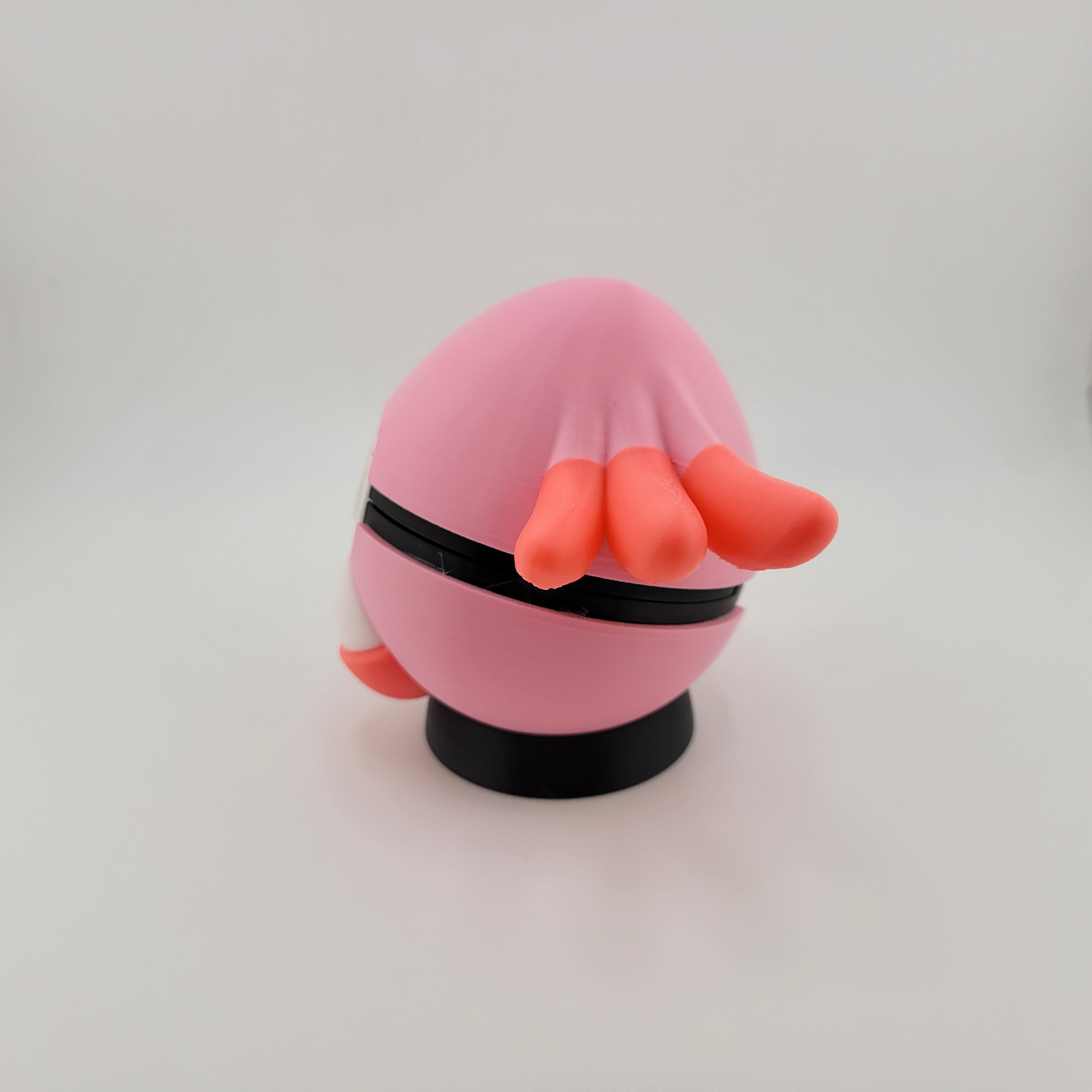 3D printed handcrafted Chansey-themed Pokeball with pink and orange details, made of durable PLA plastic.