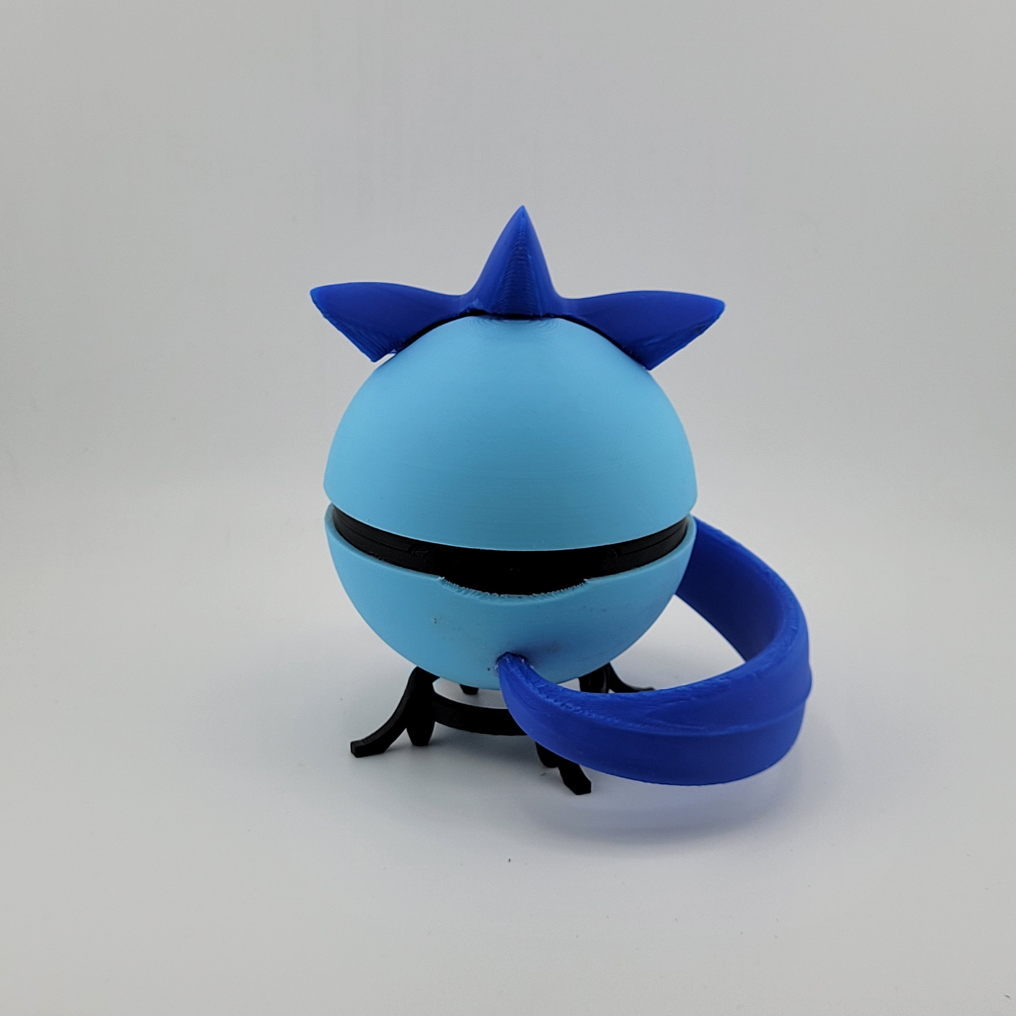 3D printed Articuno-themed Pokeball in blue with tail and spikes, handcrafted collectible model.