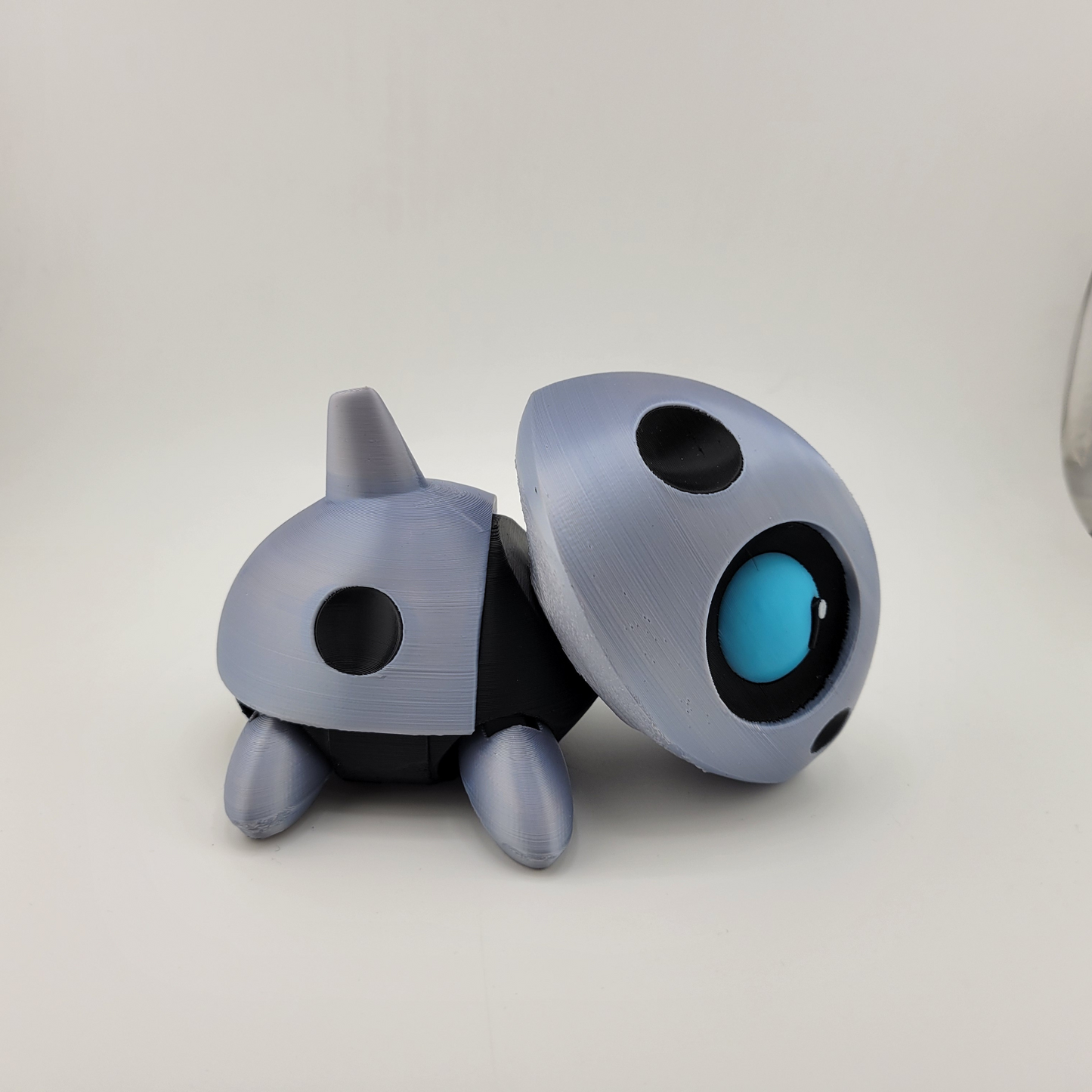 Articulated Aron Pokémon action figure with metallic body and articulated limbs for dynamic posing.