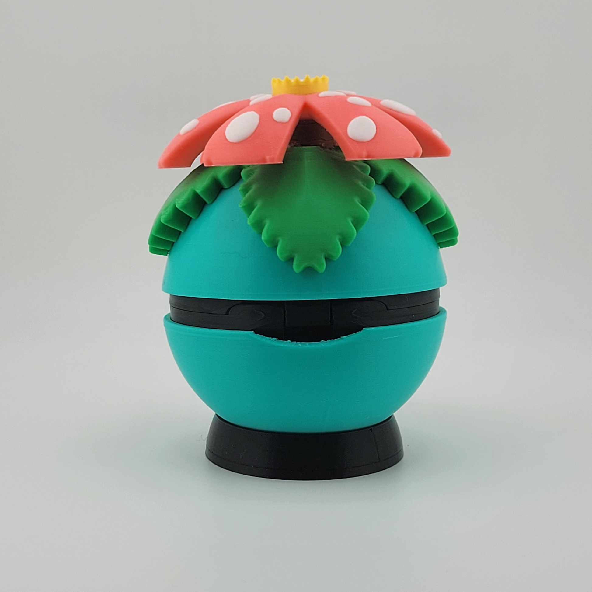 Venusaur-themed 3D printed Poké Ball with tropical flower design on top, featuring earthy colors and lush details.