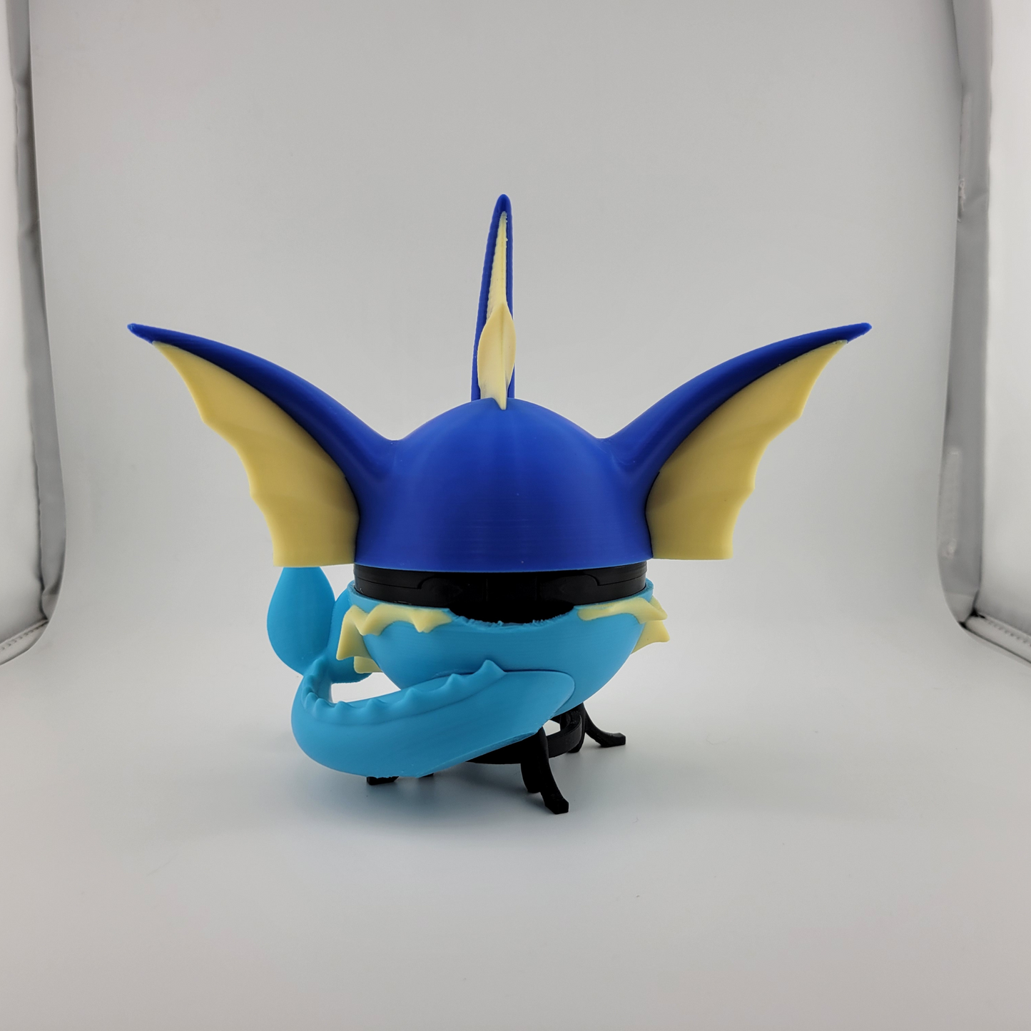 3D printed Vaporeon Pokeball from durable PLA plastic, inspired by Pokémon, detailed and handcrafted for collectors and fans.