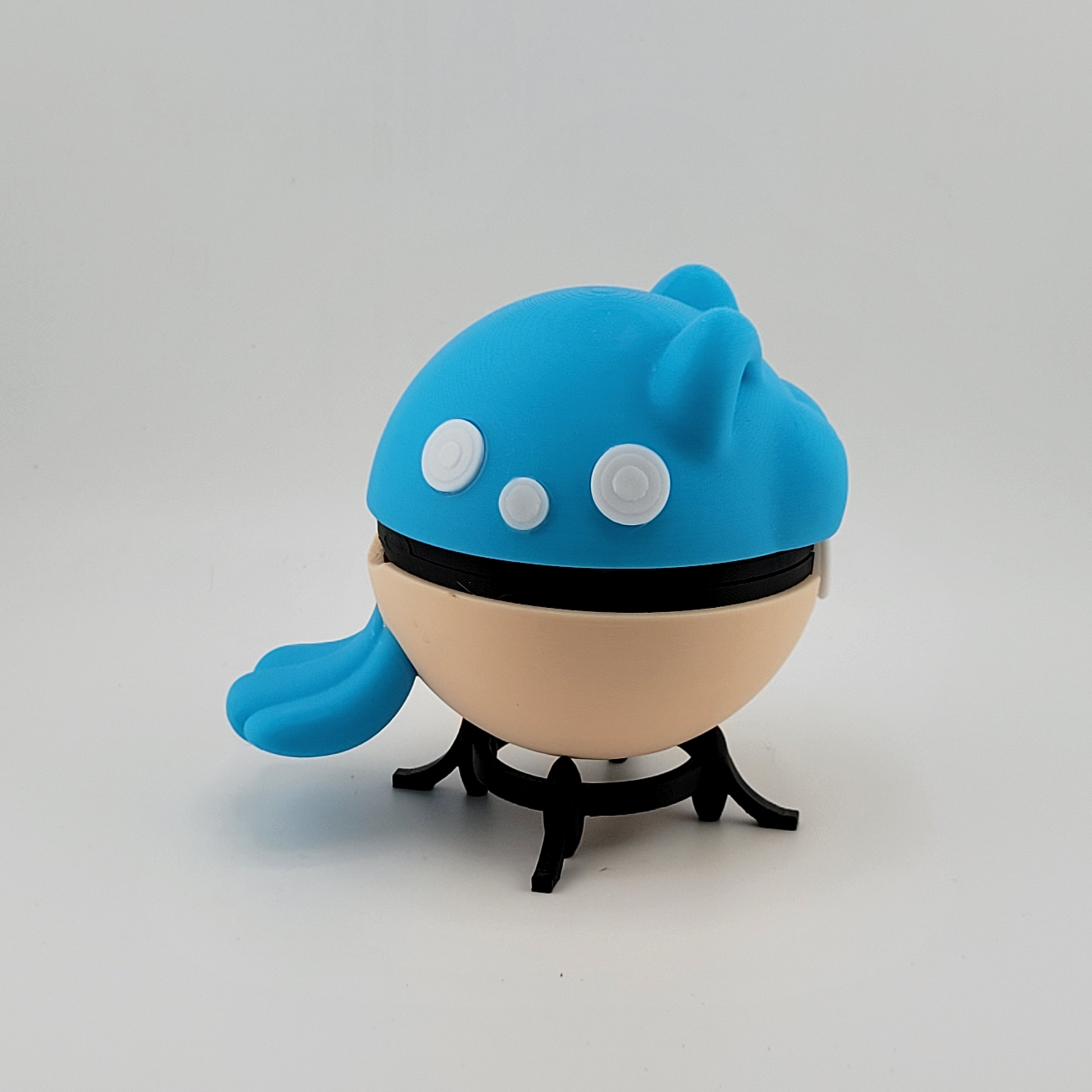 3D printed Spheal Pokeball toy with ice/water theme on display stand.