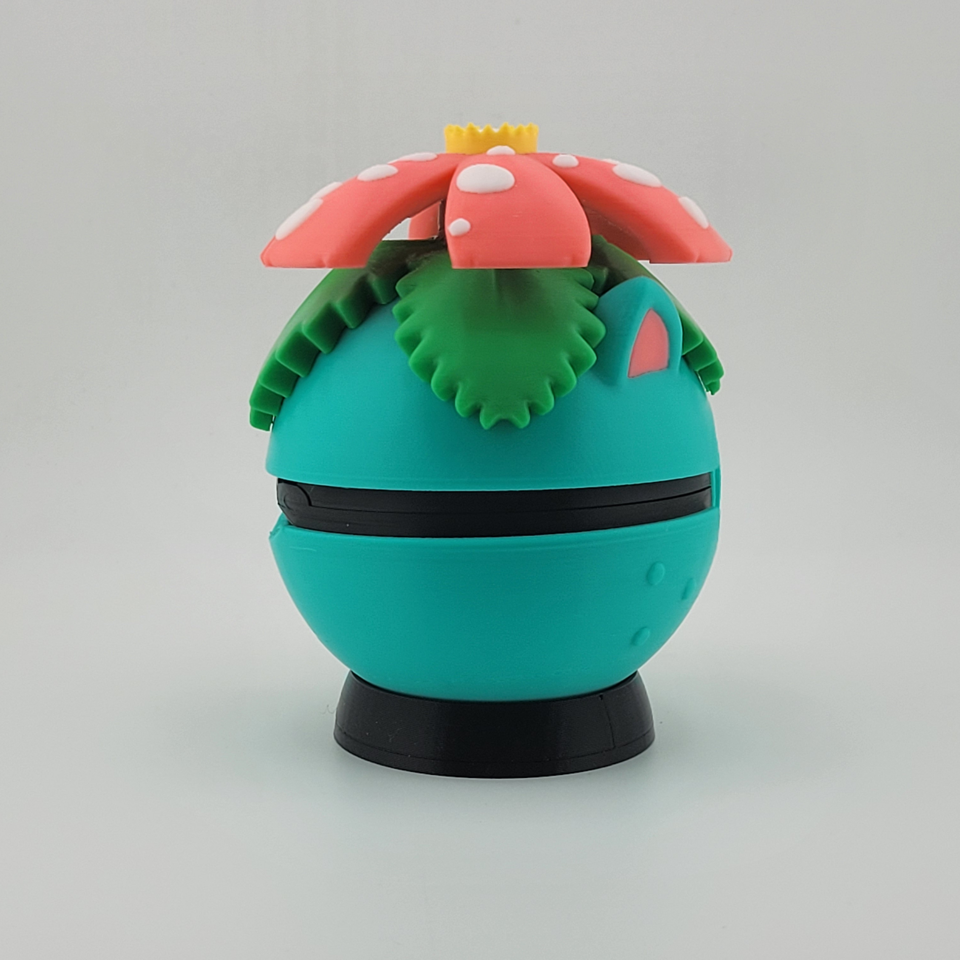 Venusaur-themed 3D printed Poké Ball with tropical flower design on top, featuring earthy colors and lush details.