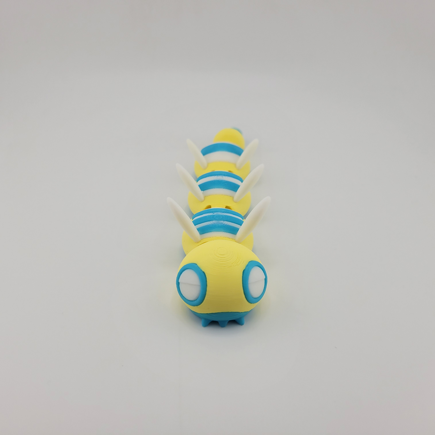 Articulated 3D printed Dudunsparce Pokémon toy with flexible joints.