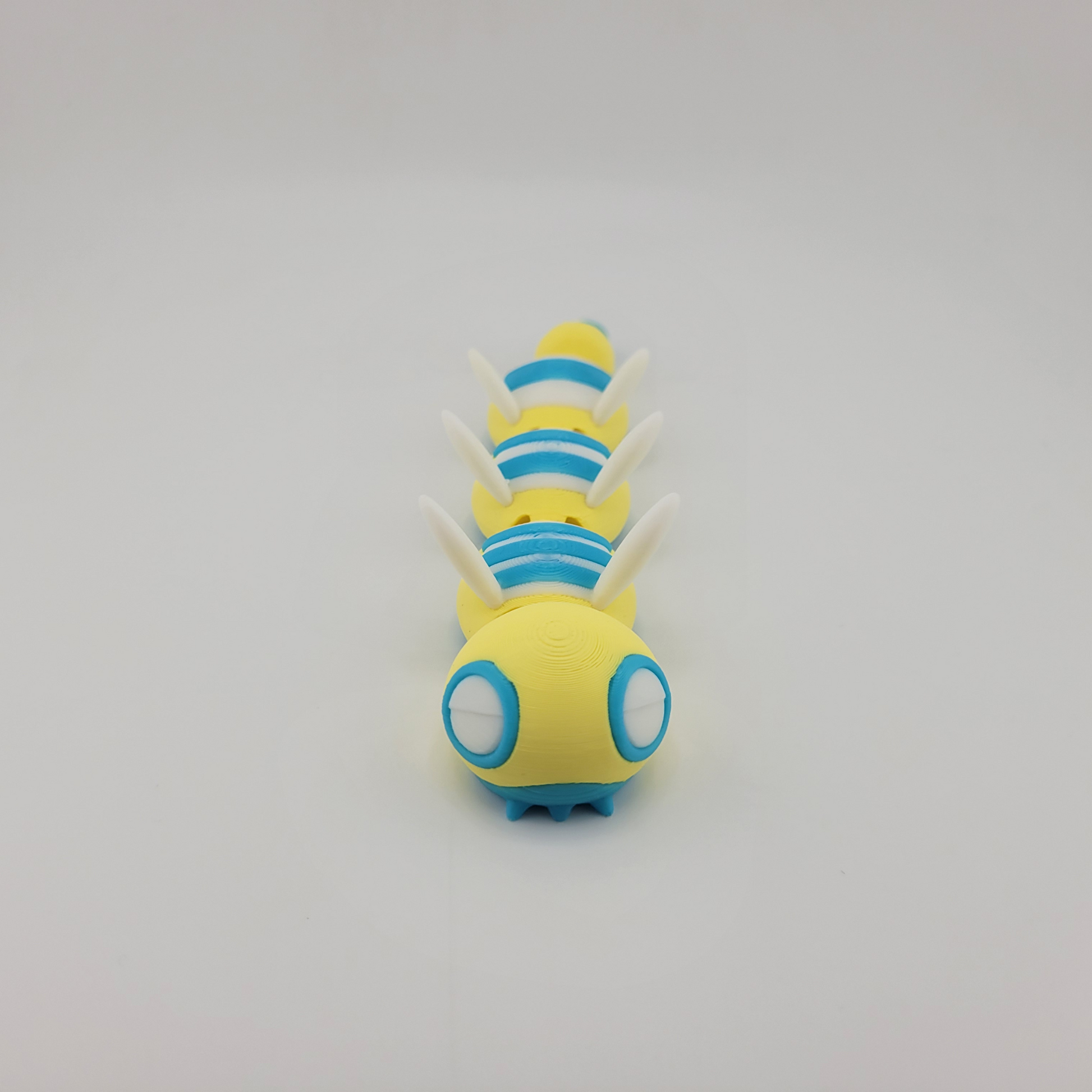 Articulated 3D printed Dudunsparce Pokémon toy with flexible joints.