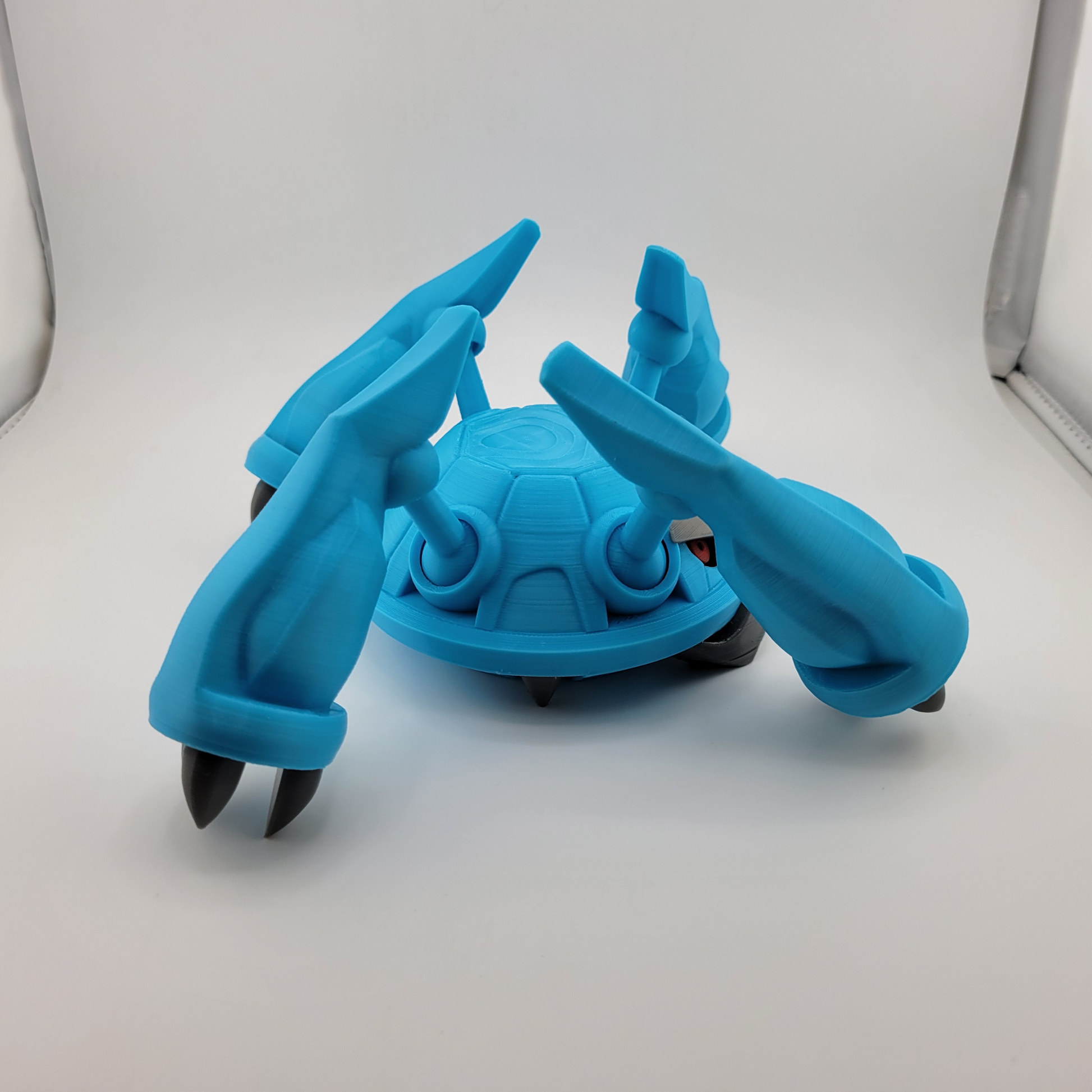 3D printed blue Metagross Pokémon toy with articulated limbs.