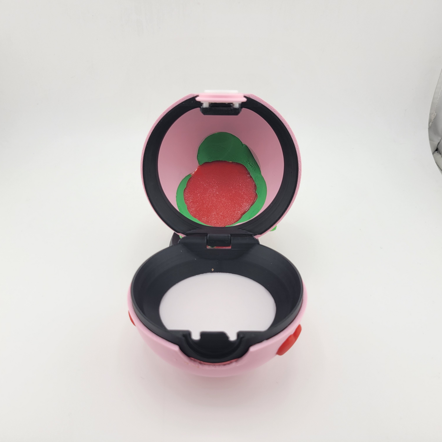 Rose Bulbasaur-themed Pokéball with elegant rose motif, inspired by Bulbasaur, handcrafted 3D print with vibrant green and pink accents.