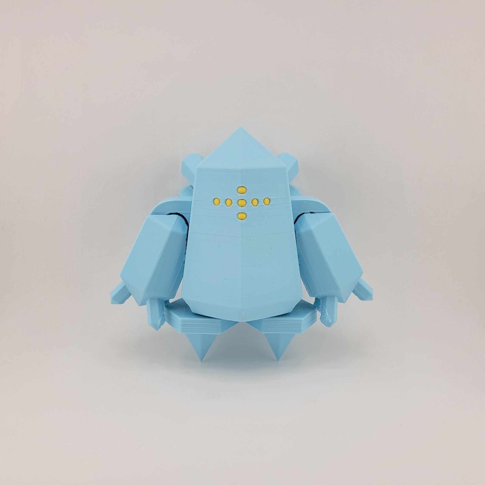 Small blue 3D printed poseable Regice figure with geometric design and yellow dot details