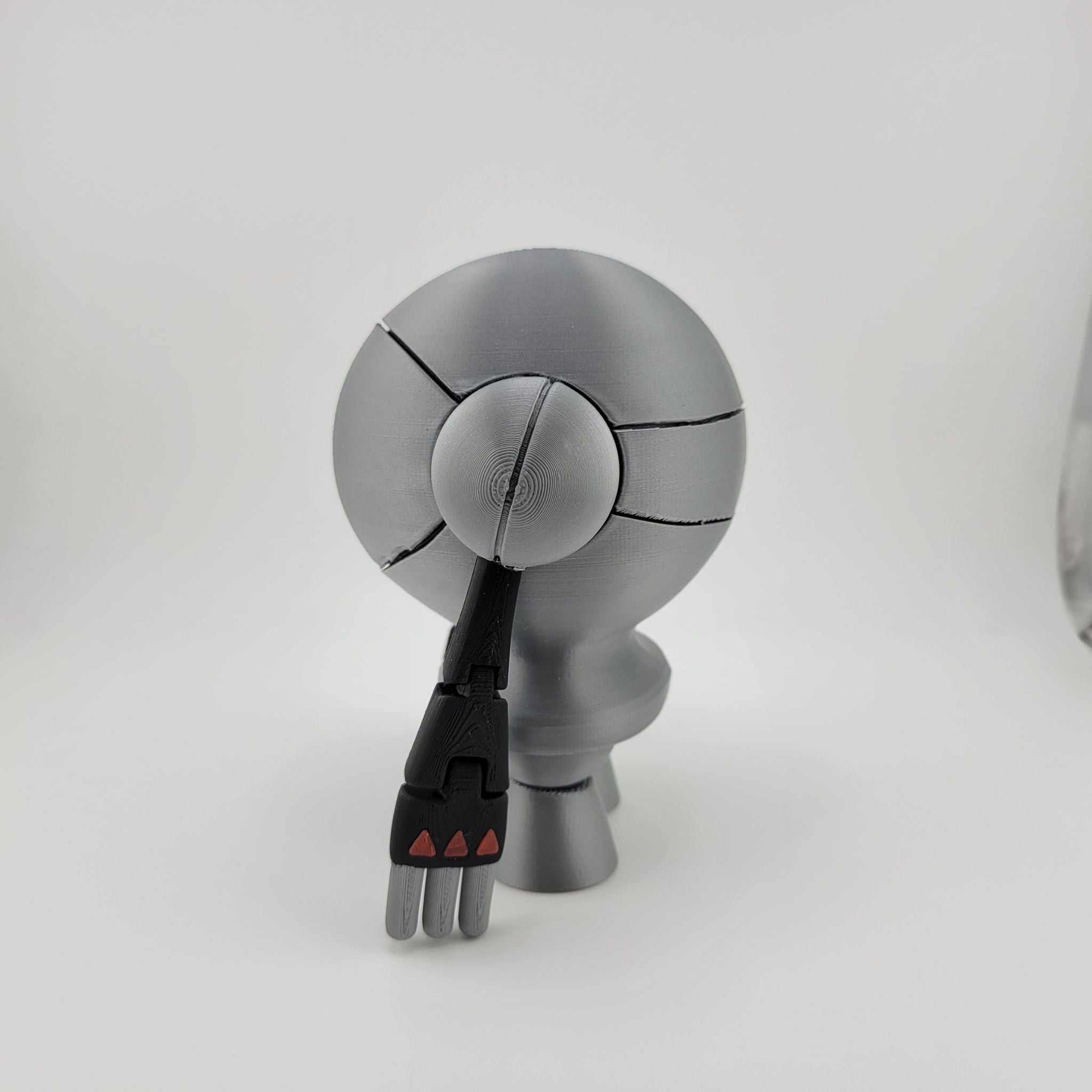 3D printed 5.5-inch silver Registeel Pokémon figure with articulated arms and sleek metallic finish