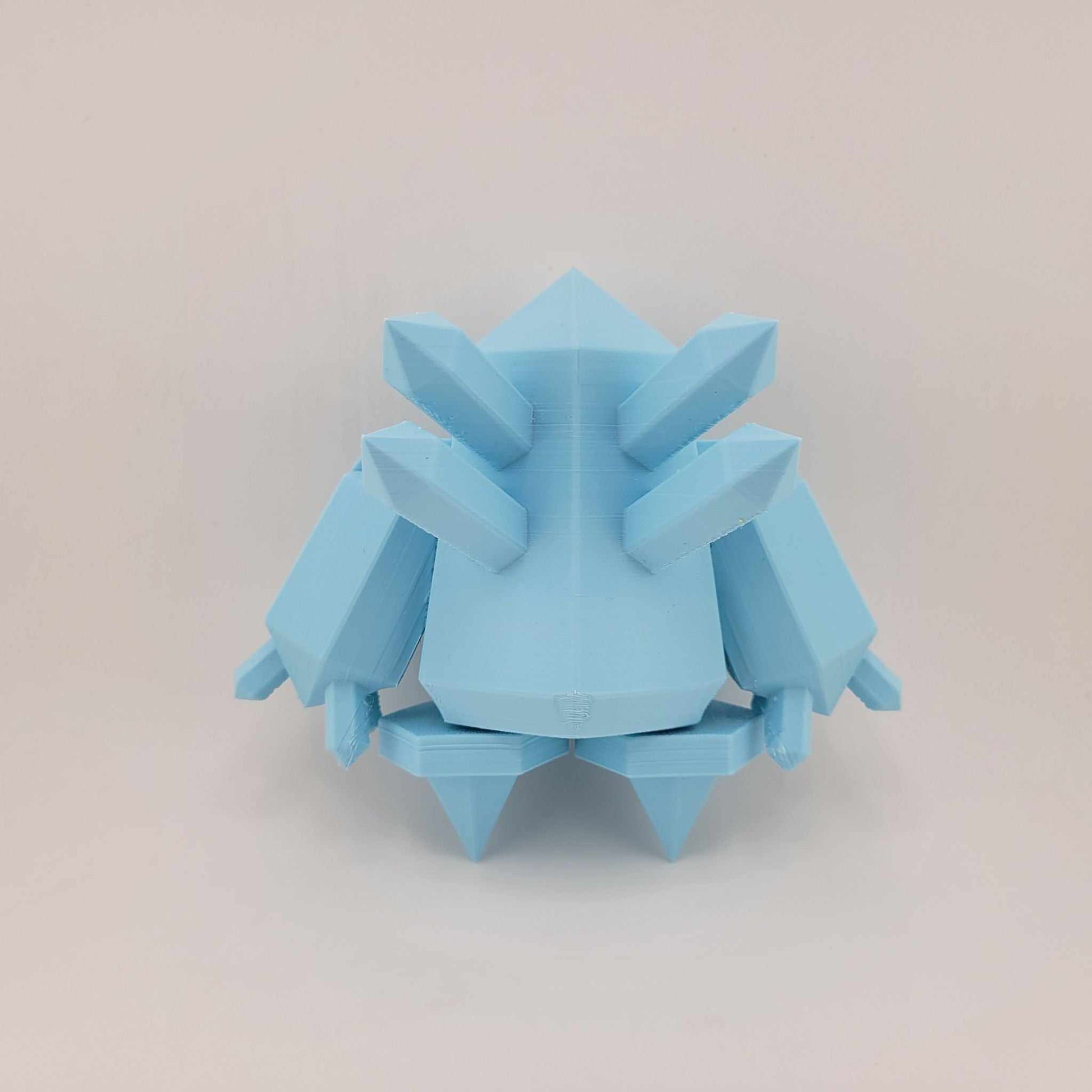3D printed small Regice figure in light blue with articulated arms and geometric crystalline design