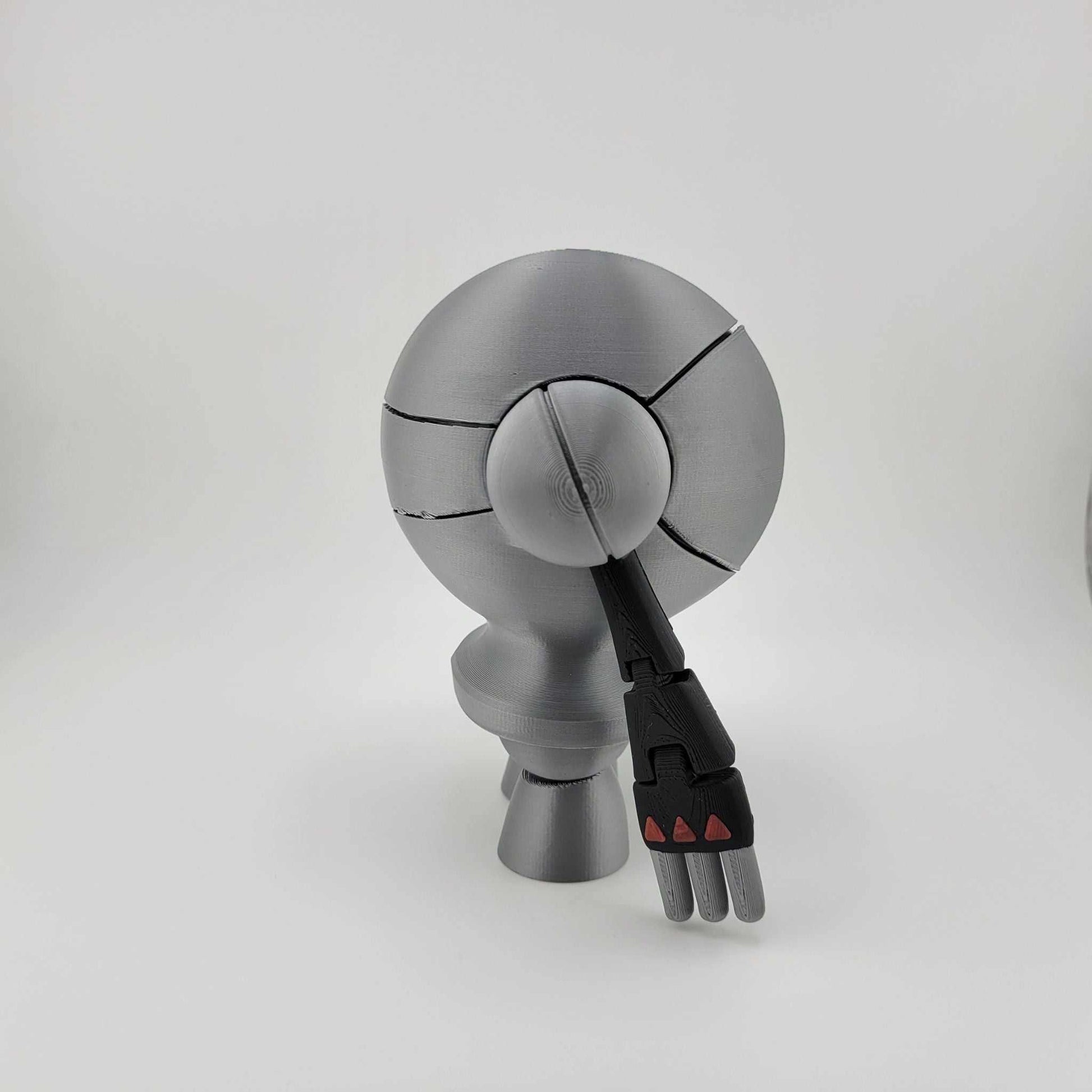 3D printed Registeel figure with articulated arm, metallic finish, and robotic design.