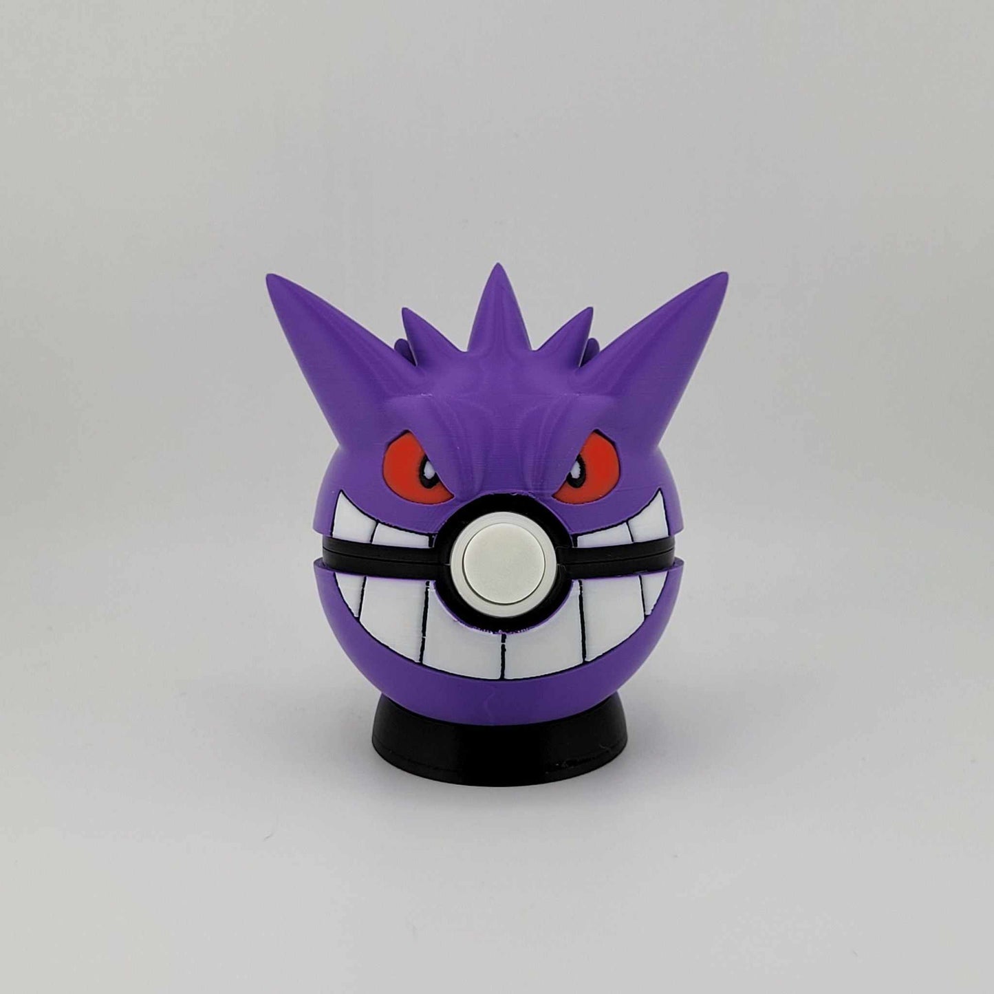 3D printed Gengar Pokeball with purple design, red eyes, and a latch button, perfect Pokémon collector's item and gift
