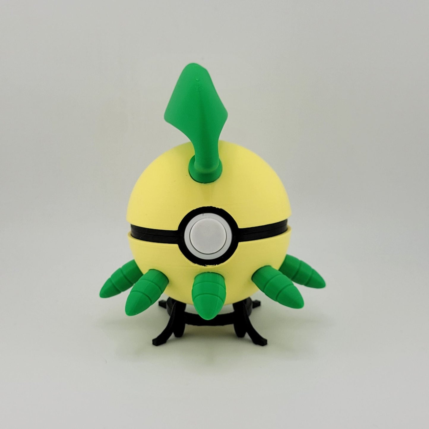 3D printed Bayleef Pokeball with green leaf details and yellow body, a functional Pokémon-themed collectible.