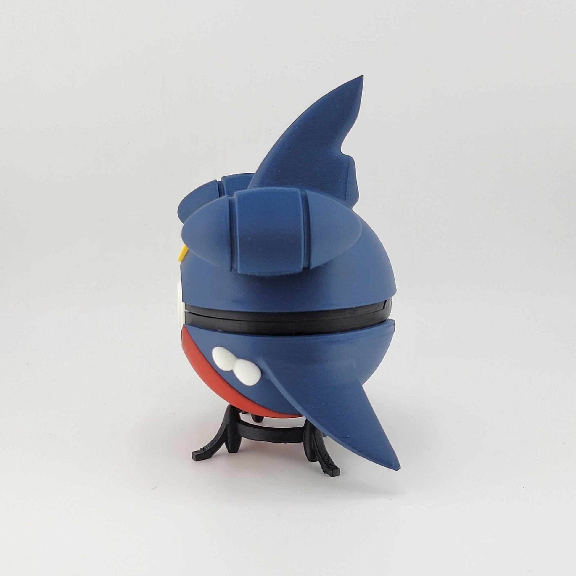 3D printed Garchomp-themed Pokeball with detailed blue and red design, handheld collectible.