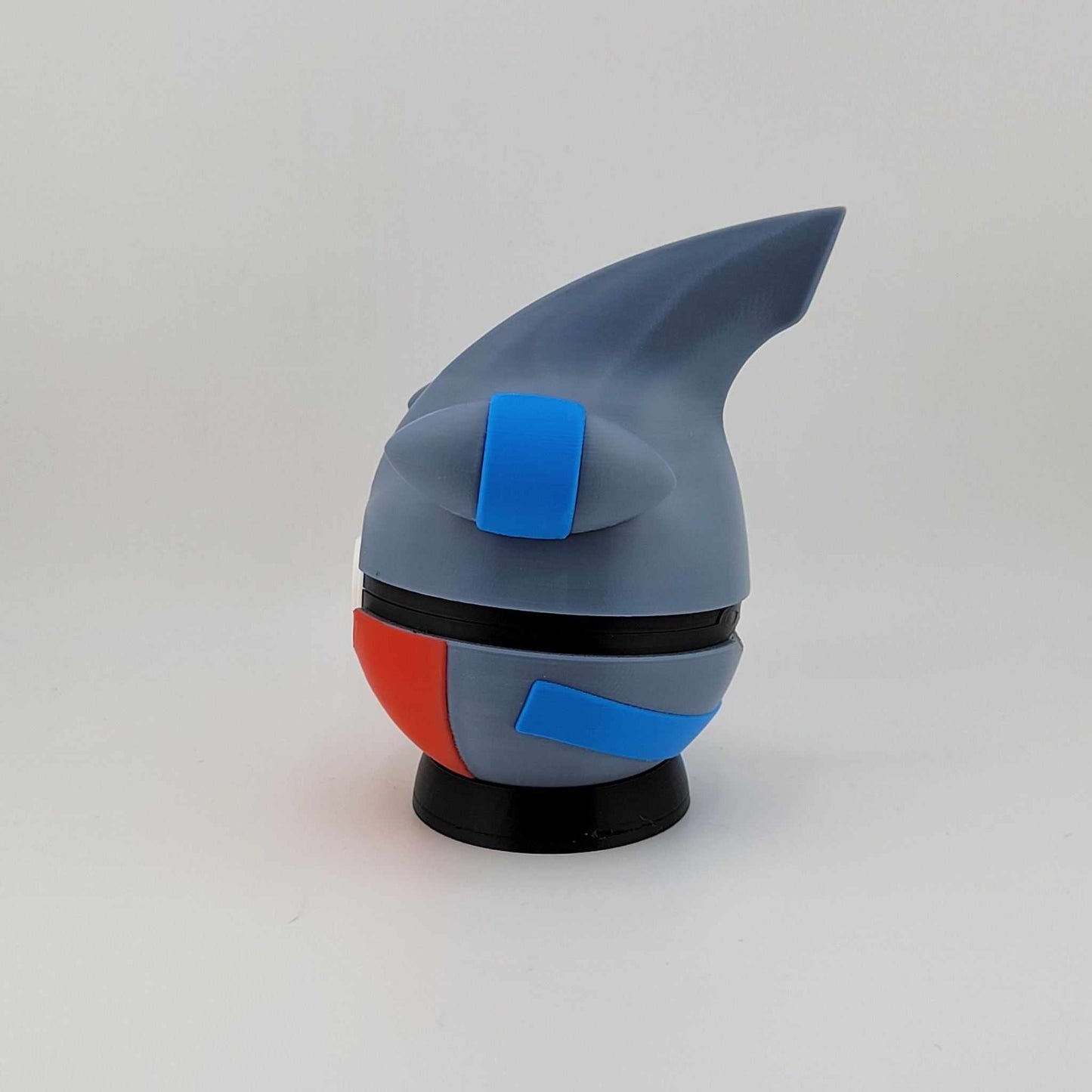 3D printed Gible-themed Pokeball with blue, gray, and red dragon-inspired design on black base