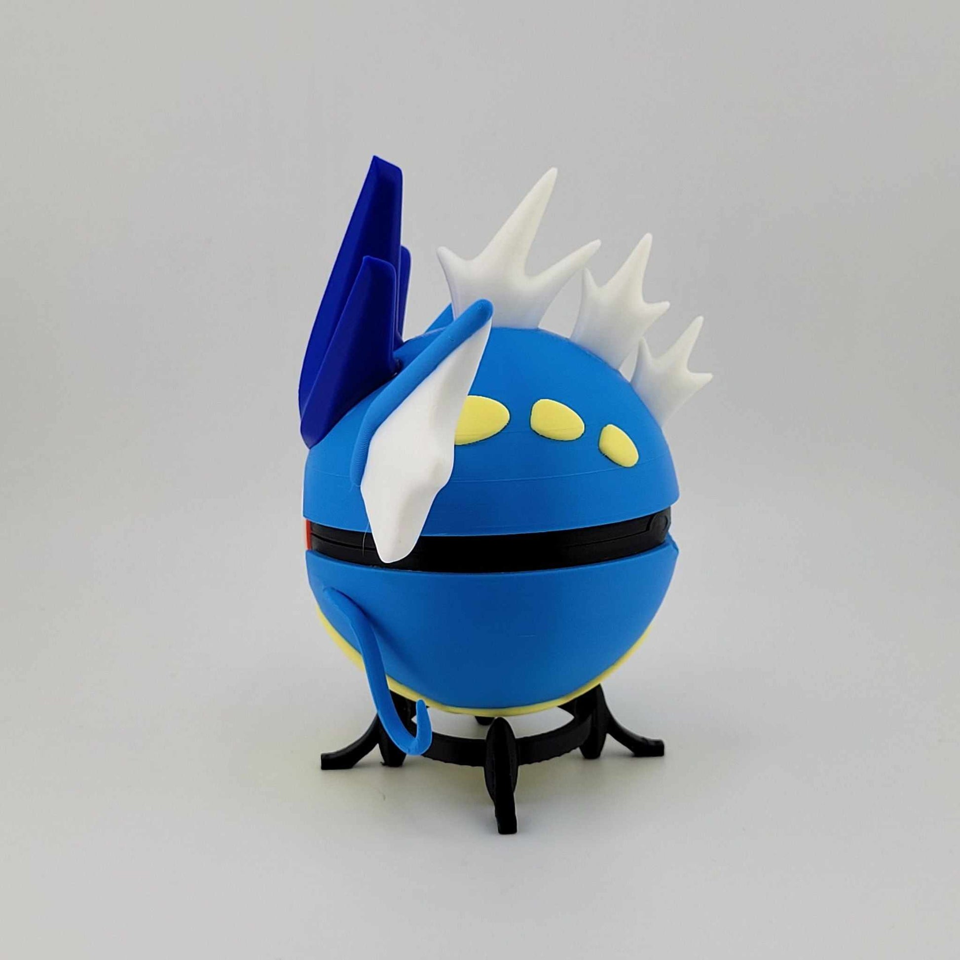 3D printed Gyarados Pokeball made of durable PLA plastic, featuring blue and white design with fins and spikes, handcrafted collectible display piece