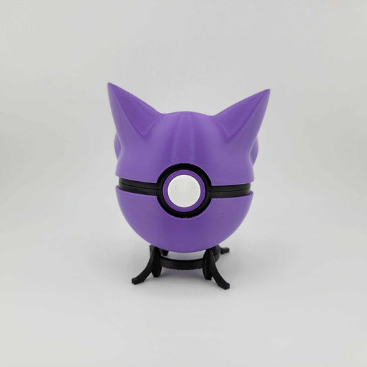 Purple Haunter-themed Pokeball 3D printed collectible with pointed ears and central button latch on black stand