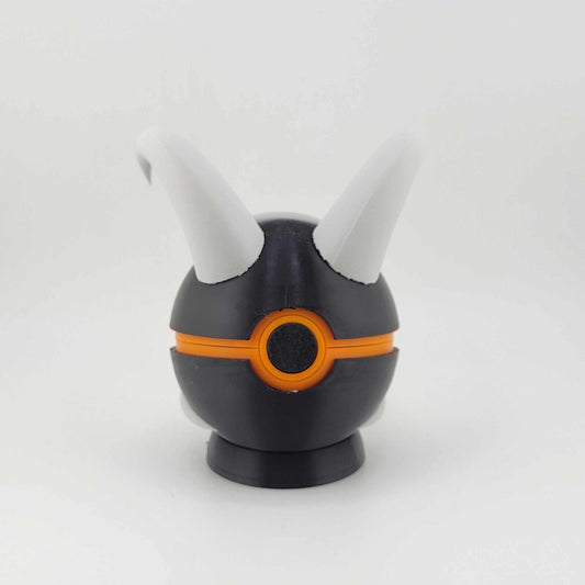 3D printed Houndoom Ball with black and orange design and white horns inspired by Pokémon
