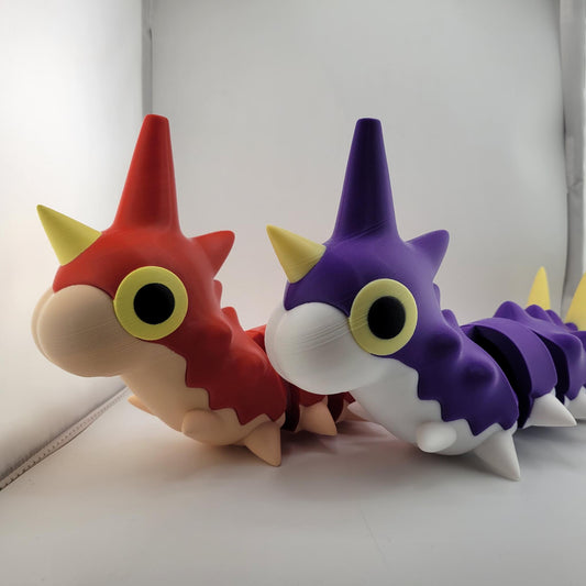Life sized articulated Wurmple Pokémon figurines in regular red and shiny purple colors made from durable PLA plastic.