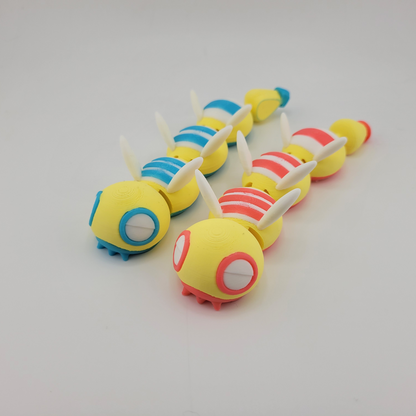 adorable articulated Dudunsparce figures with flexible joints in yellow, blue, and red trim