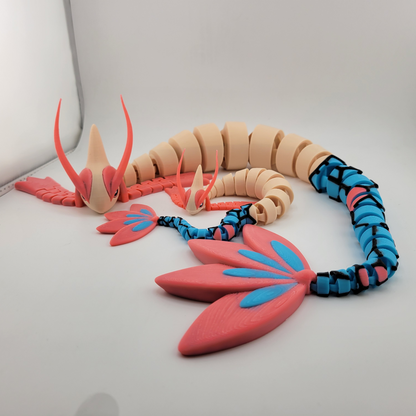 3D printed Pokémon Milotic articulated figure in dynamic pose.