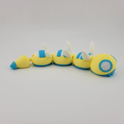 Dudunsparce articulated 3D printed Pokémon toy with flexible joints, yellow and blue design.