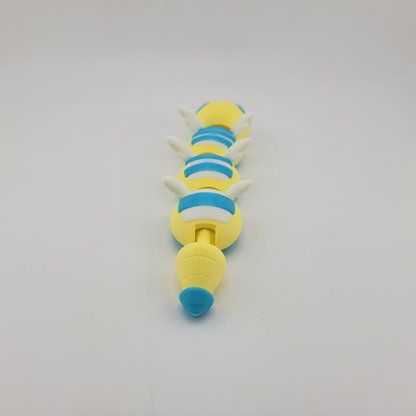 Articulated 3D printed Dudunsparce Pokémon toy with flexible joints and intricate details, showcasing its unique design.