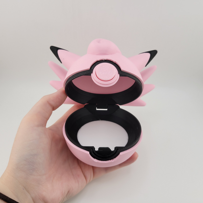 Clefable-themed Pokéball, 3D printed, pink and black design, open latch, held in hand.
