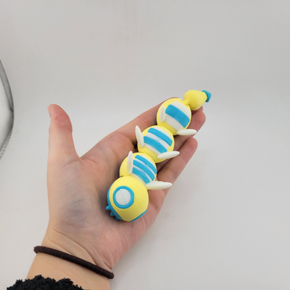 3D printed articulated Dudunsparce Pokémon toy with flexible joints.