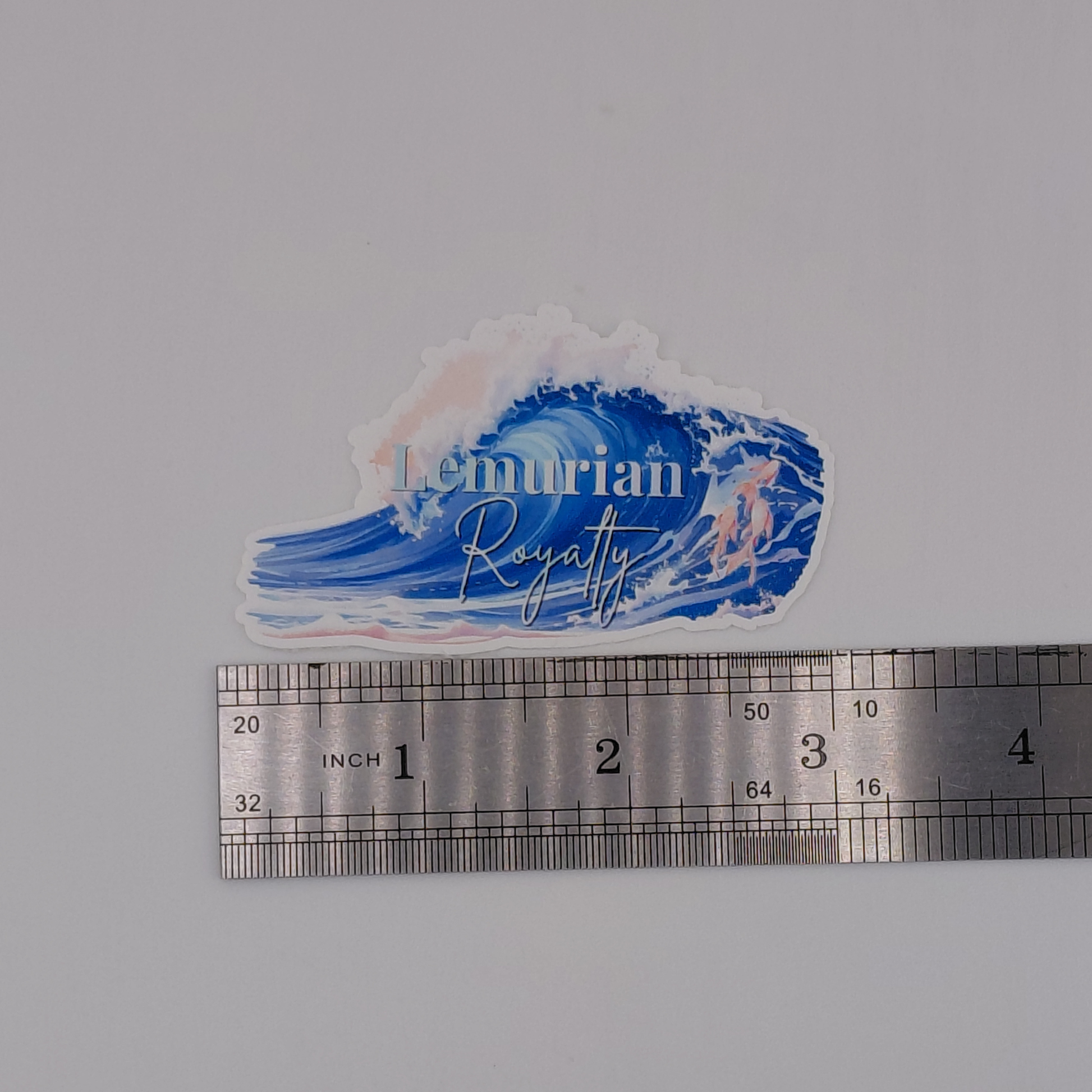 Love and Deepspace Rafayel Lemurian Royalty vinyl sticker featuring a large ocean wave in shades of blue with soft pink accents and elegant typography. Anime-inspired waterproof decal perfect for laptops, water bottles, journals, gaming accessories, and otome game collections. Aesthetic ocean-themed sticker designed for fans of Rafayel and Love and Deepspace.