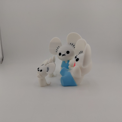 Three small white mouse figurines with black facial features and one wearing a blue outfit, photographed on a plain light gray background.