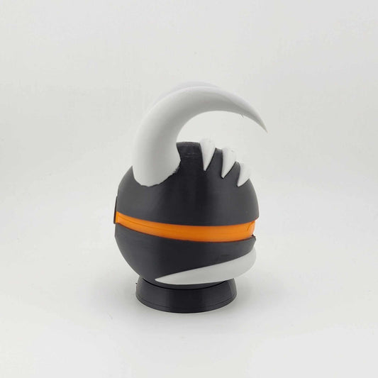 3D printed Houndoom-themed Pokeball with black body, orange band, and white horn details designed as a collectible Pokémon accessory